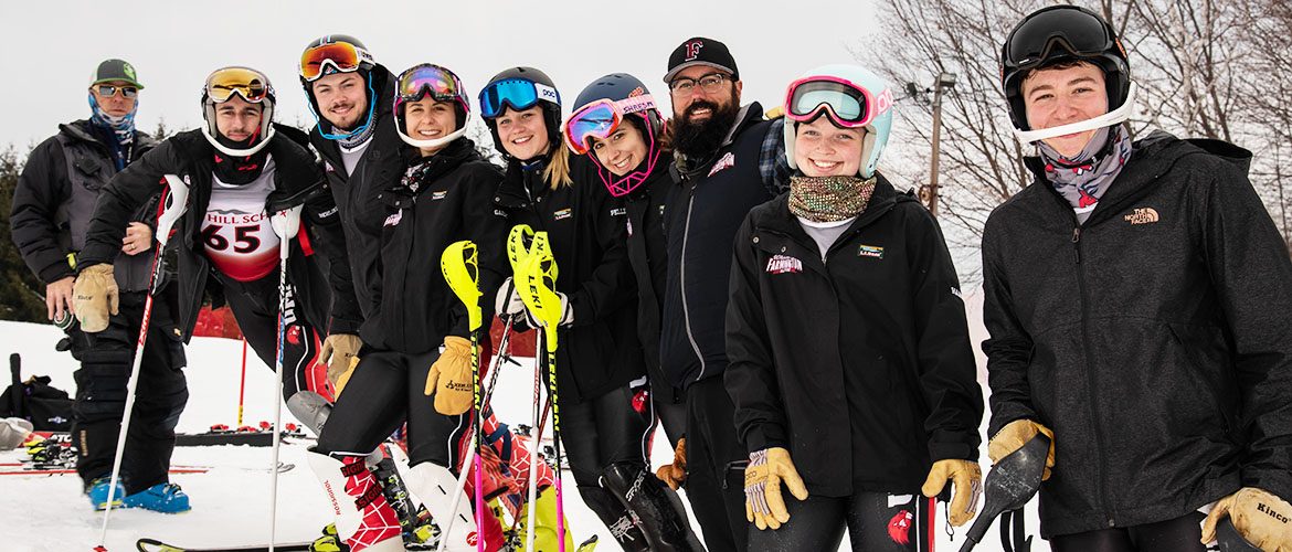 Alpine ski coach with men's and women's ski team members