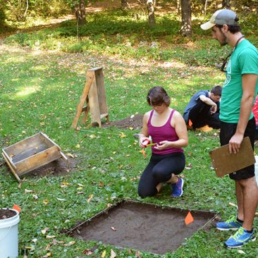 Students conducting an archaeological excavation