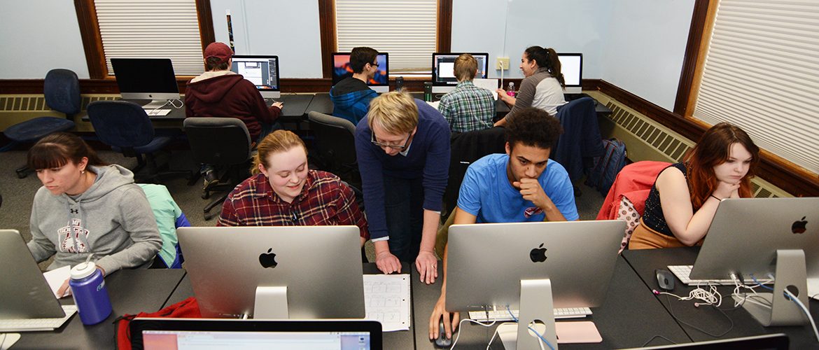 Professor and students working in New Media lab