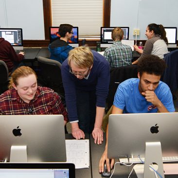 Professor and students working in New Media lab