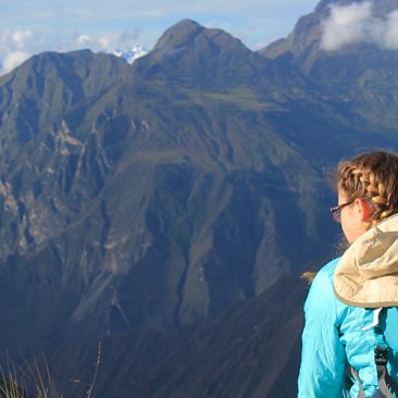 Student looking at mountain range in the Peruvian Andes