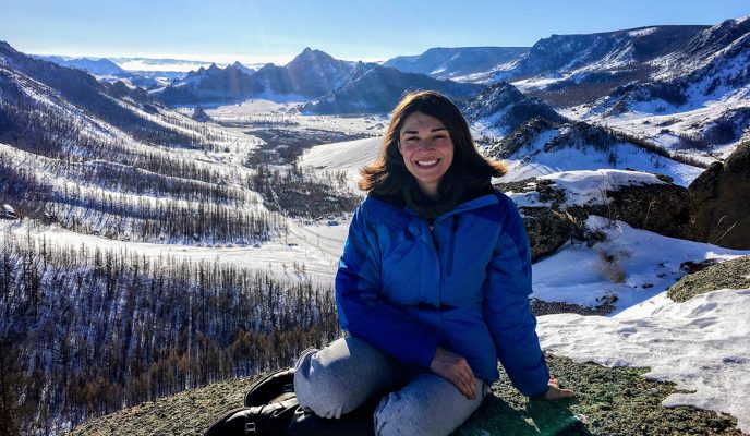 Sarah Gould atop a mountain