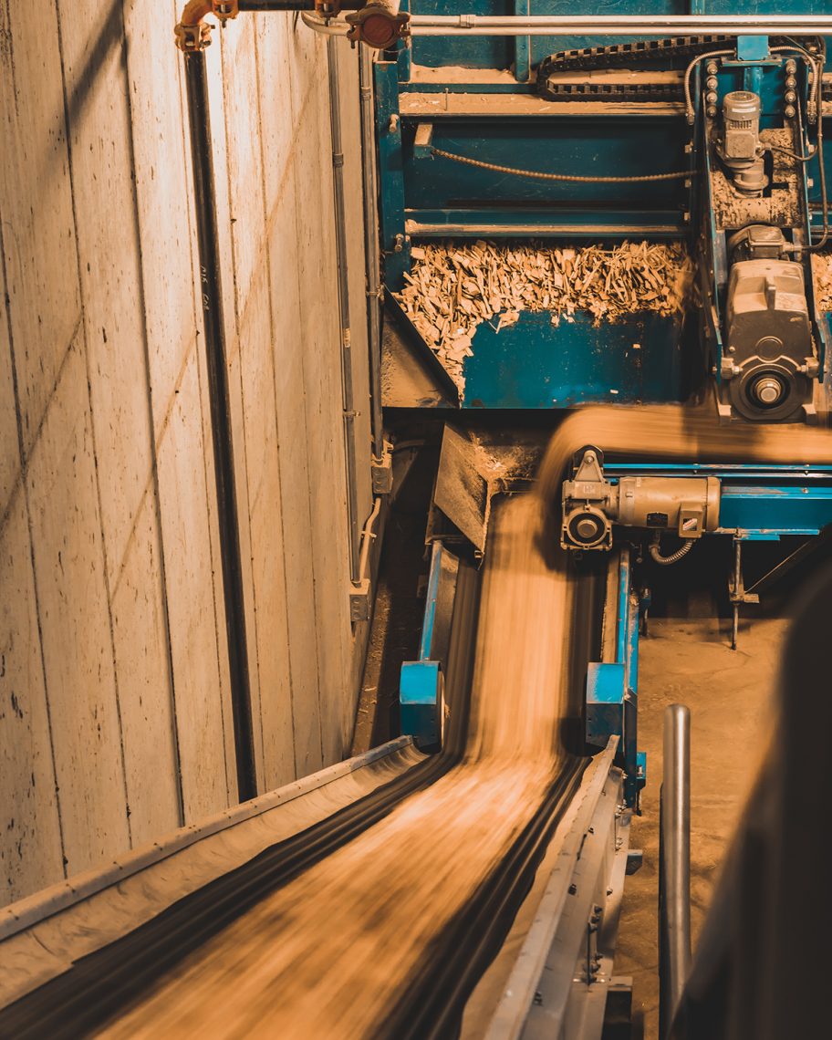 Wood chips move along a conveyor belt to the furnace. 