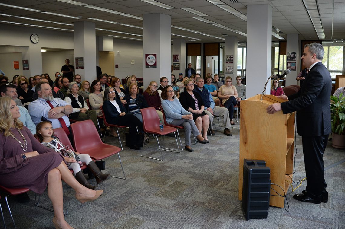Dr. Edward Serna addresses the gathering in Mantor Library.