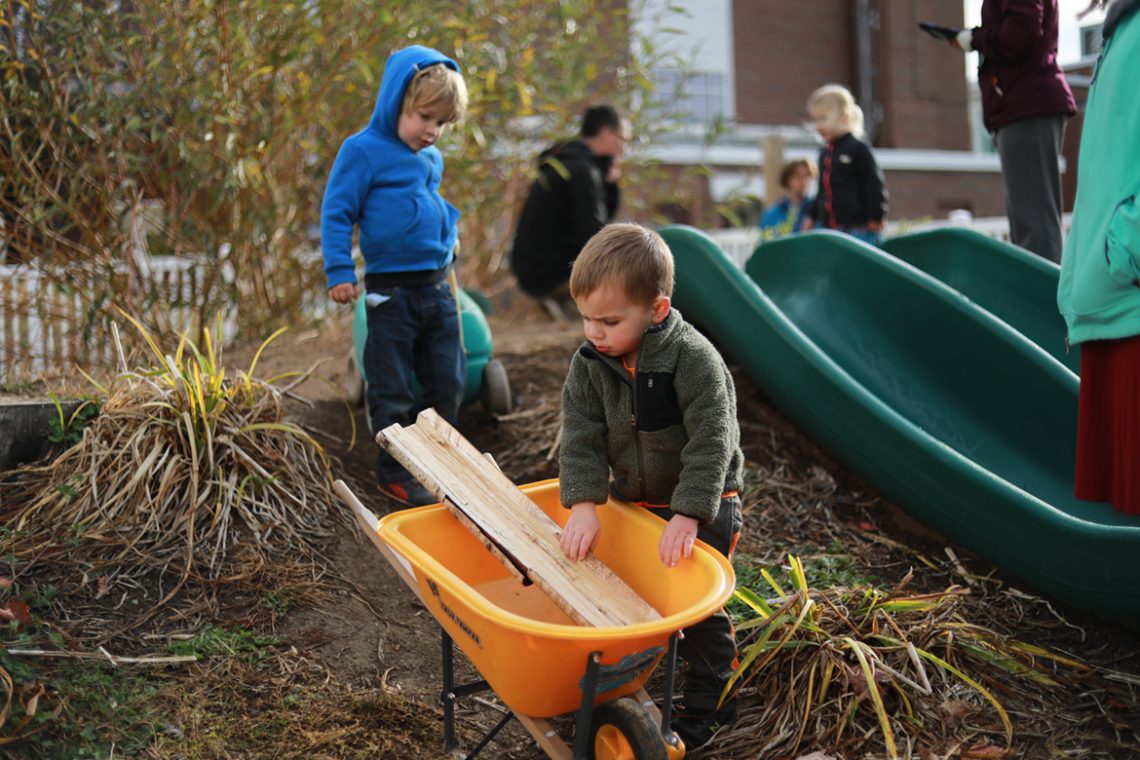 Children using the log trough at Sweatt-Winter