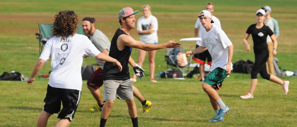 Students playing in a Club Ultimate Disc tournament