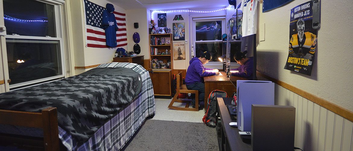 Student in a Scott Hall North Residence Hall room