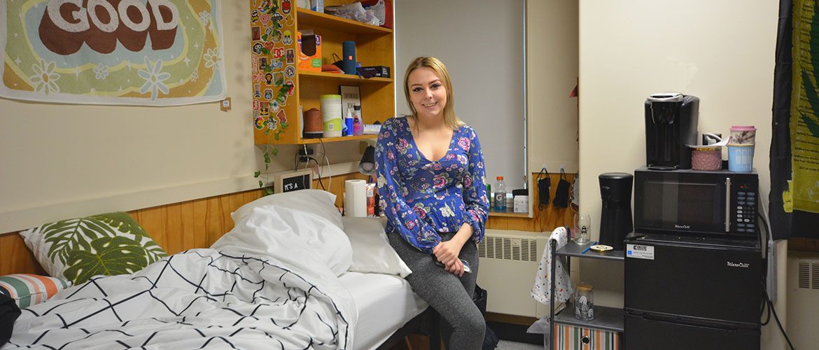 Student in a Scott Hall South Residence Hall room