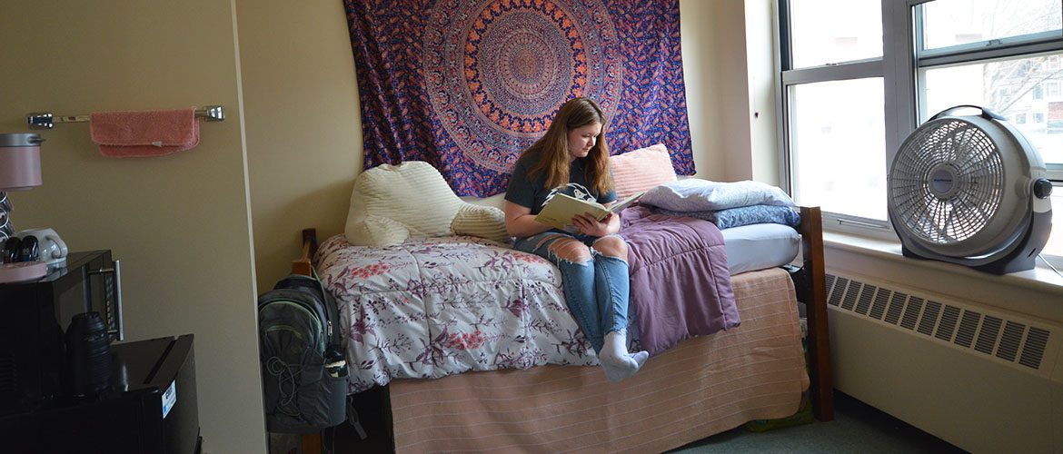 Students in a Scott Hall West Residence Hall room
