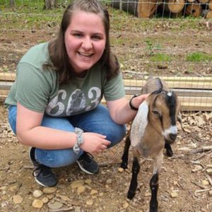 Student with a baby goat
