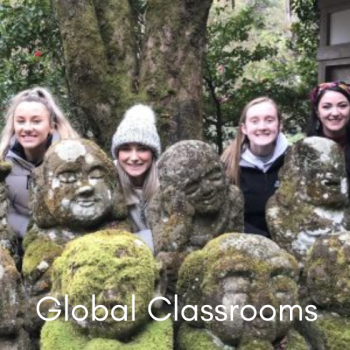 picture of students in Japan with stone statues