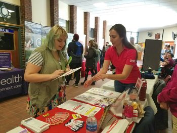 UMF student learns about employment opportunities at UMF Career Fair.