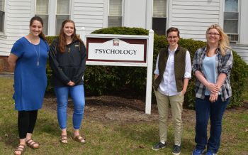 (From left to right) First grads in UMF’s Psychology 3+2 program: Charity LaFrance, Haley West, Oak Blaisdell, and Lilyan Ray. Kyla Antonioli is not pictured.