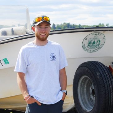 Thomas Wing, an Earth and Environmental Science graduate from the University of Maine at Farmington at his job with the Maine Department of Marine Resources.