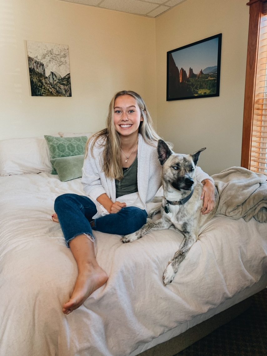 UMF student, Bridget Stephenson, first student winner of the University of Maine System’s Shot Clock Scholarship, and her dog Aspen.