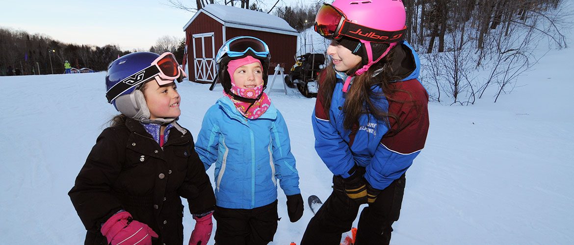 Student ski instructor working with children