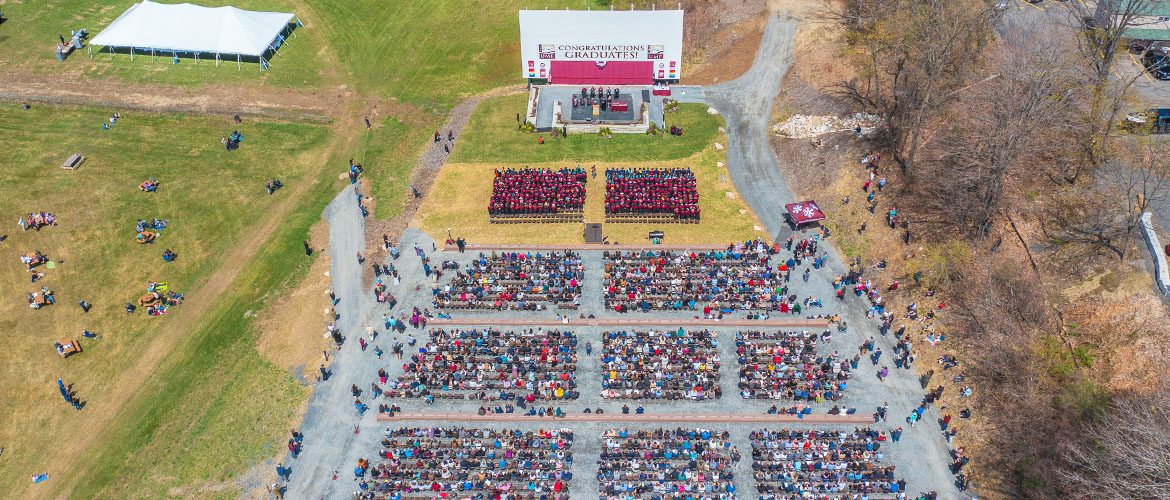 Scene from UMF's 2022 outdoors Commencement ceremony