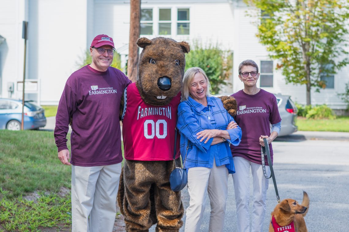 (Left to right) UMF Interim President Joseph McDonnell, UMF mascot Chompers, Maine Governor Janet Mills, Carla McDonnell and her dog Cider enjoy a beautiful move-in weekend on the Farmington campus.