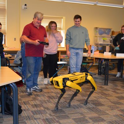 UMF students in STEM block courses have a visit from “Spot” the robot dog and learn the possibilities of using STEM concepts to solve problems.