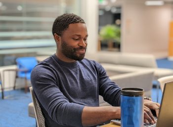 Student working at a laptop