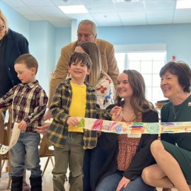 Maine Governor Mills and Senator Collins help Sweatt-Winter children with ribbon cutting.